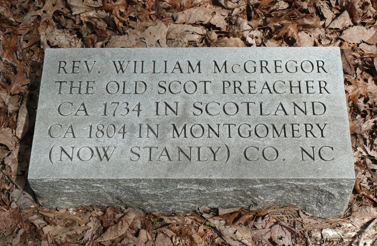 Modern engraved marker at the site